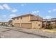 Two-story home with a terra cotta roof, two garage doors, and a stairway leading to an upper deck at 2766 Del Prado Dr # 6, Indianapolis, IN 46227