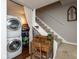 Laundry area with stacked washer and dryer, shelving, and a convenient workspace at 2766 Del Prado Dr # 6, Indianapolis, IN 46227