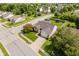 Aerial view of a brick home with well-kept lawn, mature trees, and a paved driveway, set in a residential neighborhood at 293 E Quail Wood Ln, Westfield, IN 46074