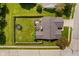 Birds-eye view of a fenced backyard featuring a trampoline, well-maintained lawn, patio furniture, and mature trees at 293 E Quail Wood Ln, Westfield, IN 46074