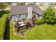 A spacious wooden deck in backyard features patio furniture, grill, and meticulously landscaped garden at 293 E Quail Wood Ln, Westfield, IN 46074
