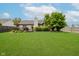 Spacious backyard with lush green lawn and a charming deck at 293 E Quail Wood Ln, Westfield, IN 46074