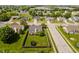 Aerial view of a fenced backyard featuring a well-maintained lawn, deck with outdoor furniture, and a trampoline at 293 E Quail Wood Ln, Westfield, IN 46074