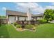 Well-maintained backyard with a patio, lush landscaping, and privacy fencing at 293 E Quail Wood Ln, Westfield, IN 46074