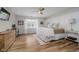 Inviting bedroom with elegant decor, featuring a large window and hardwood floors at 293 E Quail Wood Ln, Westfield, IN 46074