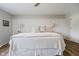 Comfortable bedroom showcasing a king bed, soft lighting, and hardwood floors at 293 E Quail Wood Ln, Westfield, IN 46074