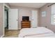 Comfortable bedroom with wood-look flooring and neutral walls at 293 E Quail Wood Ln, Westfield, IN 46074
