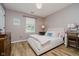 Charming bedroom with wood-look floors, soft colors, and a cozy bed at 293 E Quail Wood Ln, Westfield, IN 46074