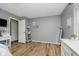 Bright bedroom features wood-look flooring, neutral paint, and modern accents at 293 E Quail Wood Ln, Westfield, IN 46074