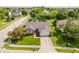 Charming brick home with a manicured front lawn and a paved driveway leading to an attached two-car garage at 293 E Quail Wood Ln, Westfield, IN 46074