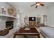 Inviting living room with brick fireplace, vaulted ceilings, neutral tones, and ample natural light at 293 E Quail Wood Ln, Westfield, IN 46074