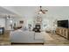 Bright living room featuring a grey sofa, brick fireplace, and open layout at 293 E Quail Wood Ln, Westfield, IN 46074