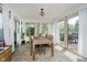 Bright sunroom with large windows and sliding glass doors, providing access to outdoor deck at 293 E Quail Wood Ln, Westfield, IN 46074