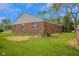 Exterior view of brick home with a spacious backyard and plenty of room at 3148 Arbutus Dr, Indianapolis, IN 46224