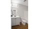 Bathroom with white vanity, updated lighting, and tub and shower combo at 3148 Arbutus Dr, Indianapolis, IN 46224