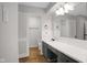 Bathroom with gray cabinets, a large mirror, and modern fixtures at 3148 Arbutus Dr, Indianapolis, IN 46224