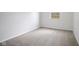 An empty bedroom with plush carpeting and newly painted white walls at 3148 Arbutus Dr, Indianapolis, IN 46224