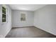 Bedroom with gray carpet, gray paint, and a window with outside view at 3148 Arbutus Dr, Indianapolis, IN 46224