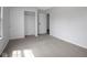 A neutral bedroom featuring a closet and a view into the hall at 3148 Arbutus Dr, Indianapolis, IN 46224