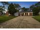 Exterior front of home with landscaped yard, brick facade and attached garage at 3148 Arbutus Dr, Indianapolis, IN 46224