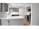 Bright, modern kitchen features stainless steel appliances and crisp white countertops at 3148 Arbutus Dr, Indianapolis, IN 46224