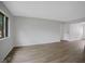 Bright living room with hardwood floors and neutral paint at 3148 Arbutus Dr, Indianapolis, IN 46224