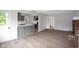 Open-concept living area flows seamlessly from the kitchen with a brick fireplace focal point at 3148 Arbutus Dr, Indianapolis, IN 46224