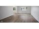 Bright living room with hardwood floors and natural light from large windows at 3148 Arbutus Dr, Indianapolis, IN 46224