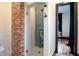 Modern bathroom with glass shower, designer tile and black trim at 321 N Rangeline Rd, Carmel, IN 46032