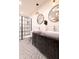 Stylish bathroom features double sinks, decorative tile floors, and a glass-enclosed shower at 321 N Rangeline Rd, Carmel, IN 46032