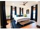 Serene bedroom boasts abundant natural light from large windows and features modern decor at 321 N Rangeline Rd, Carmel, IN 46032