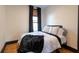 Cozy bedroom featuring a comfortable queen bed, hardwood floors, and stylish decor at 321 N Rangeline Rd, Carmel, IN 46032