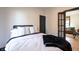 Cozy bedroom featuring a comfortable queen bed, hardwood floors, and stylish decor at 321 N Rangeline Rd, Carmel, IN 46032