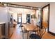Open-concept dining area features stainless steel appliances and flows into a cozy living space at 321 N Rangeline Rd, Carmel, IN 46032
