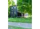Charming two-story home with dark siding, white trim, a covered porch, and a well-manicured lawn at 321 N Rangeline Rd, Carmel, IN 46032