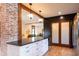 Open concept kitchen with a large island, stainless steel appliances, and a view into the living room at 321 N Rangeline Rd, Carmel, IN 46032