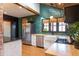 Bright kitchen featuring green backsplash, butcher block countertops, stainless steel appliances, and modern fixtures at 321 N Rangeline Rd, Carmel, IN 46032