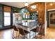 Modern kitchen with green backsplash, butcher block countertops, a stainless steel fridge and large island with seating at 321 N Rangeline Rd, Carmel, IN 46032