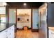 The kitchen boasts a large pantry with sliding doors, complemented by stainless steel appliances and hardwood floors at 321 N Rangeline Rd, Carmel, IN 46032