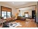 Bright living room with hardwood floors, bamboo shades, and comfortable seating with decor at 321 N Rangeline Rd, Carmel, IN 46032