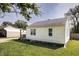 Home featuring a big backyard, a detached garage, and small deck at 321 S Biltmore Ave, Indianapolis, IN 46241
