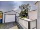Backyard showcasing a detached garage and a wood deck at 321 S Biltmore Ave, Indianapolis, IN 46241