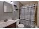 Cozy bathroom featuring a shower with modern fixtures, sleek vanity, and updated tile at 321 S Biltmore Ave, Indianapolis, IN 46241
