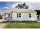 Charming home featuring a cozy front porch and well-maintained lawn at 321 S Biltmore Ave, Indianapolis, IN 46241