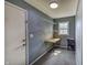 Office space with gray walls, door access, a foldable wood desk, and built-in shelving at 321 S Biltmore Ave, Indianapolis, IN 46241