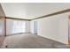 Bright living room featuring carpet and natural lighting at 3425 Ireland Dr, Indianapolis, IN 46235