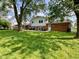 Lush backyard offers ample room, with an outdoor grill area at 3520 Lantern Ln, Columbus, IN 47203