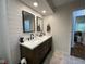 Bathroom features a double vanity, sleek mirrors and contemporary fixtures at 3520 Lantern Ln, Columbus, IN 47203