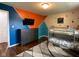 A bedroom featuring a bunk bed, dresser, and colorful accent wall at 3520 Lantern Ln, Columbus, IN 47203