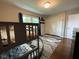 A bedroom with a bunk bed, large rug, and view of the window and closet at 3520 Lantern Ln, Columbus, IN 47203